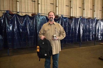 Bryan Suarez with his Steel Apple award and Carhartt gear package