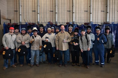Bryan Suarez with his Dr. Kirk Lewis Career and Technical students