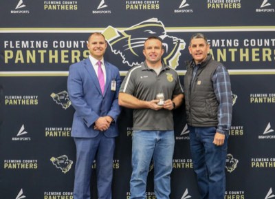 Bobby Pease with Fleming County High School official and William Hardy, SVP of Supply Chain at Carhartt
