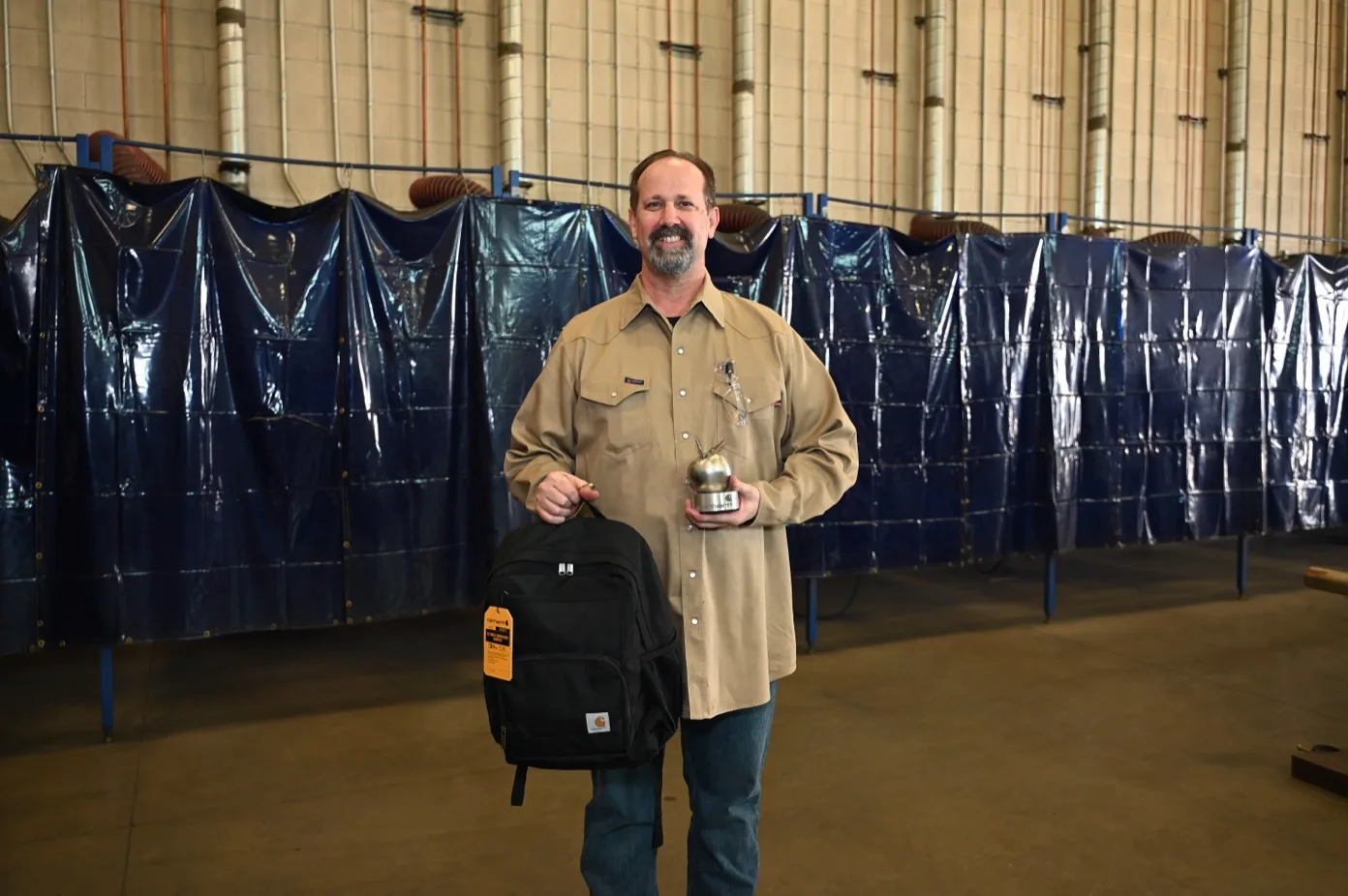 Bryan Suarez with his Steel Apple Award and Carhartt gear package