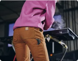 Welder in Carhartt pants
