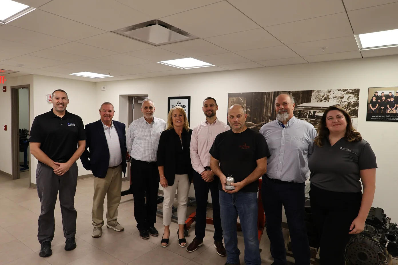 Mike Coughlin being presented the Steel Apple Award by SUNY Erie administrators and TechForce’s JeanMarie DeLuca